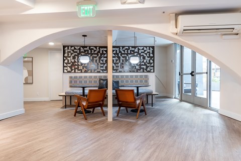 A room with a table and chairs in it.