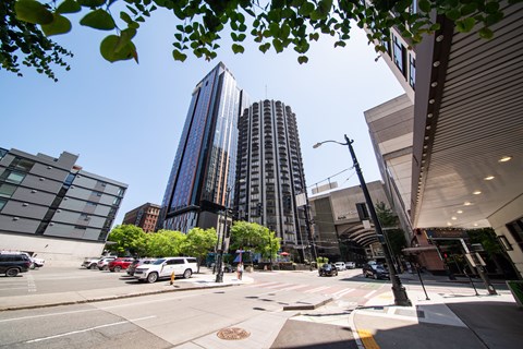 A city street with cars and buildings.
