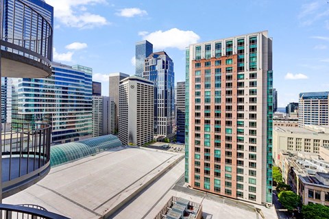 a view of the city skyline from the roof of a building