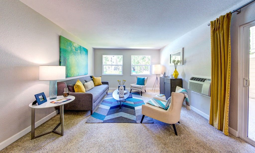 a living room with a couch and a table