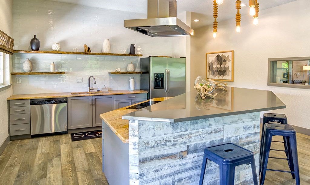 a kitchen with a counter and bar stools