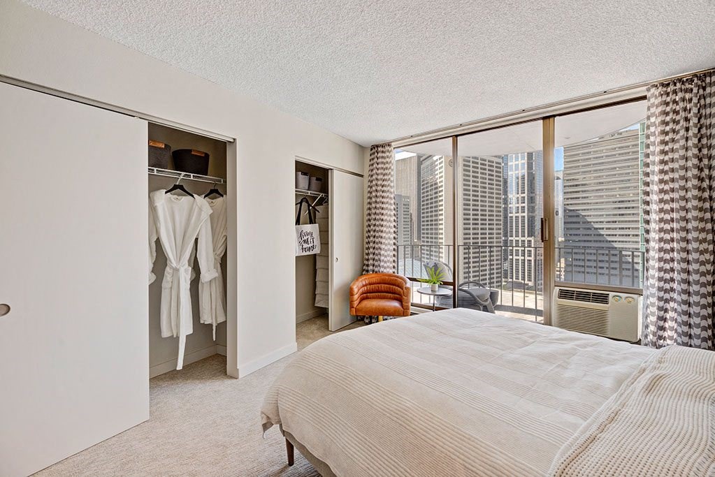 a bedroom with a bed and a closet