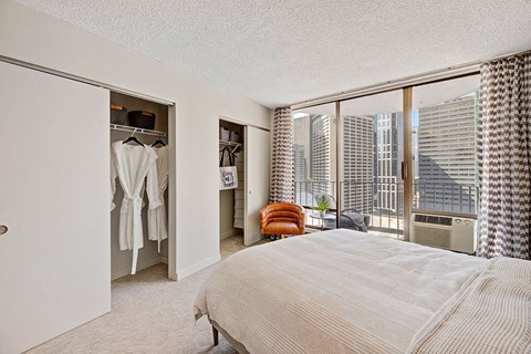 a bedroom with a bed and a closet