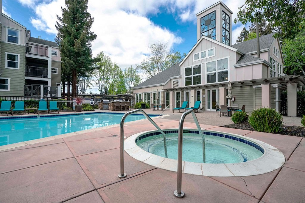 a swimming pool with a building in the background