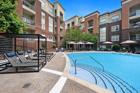 our apartments offer a swimming pool with lounge chairs and umbrellas