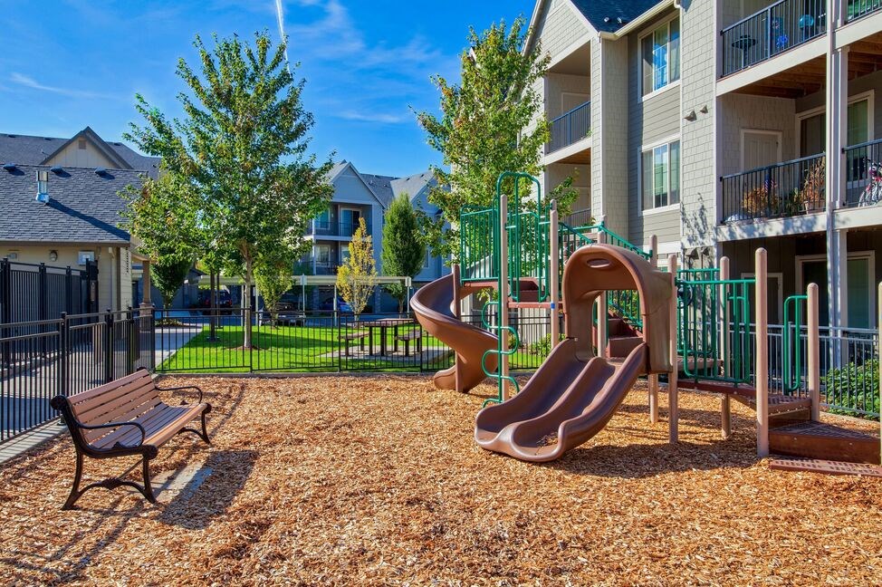 our apartments have a playground with slides and a picnic table