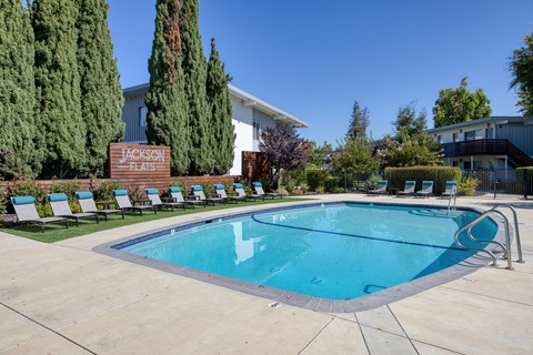 A pool with a sign that says Jackson Hearns.