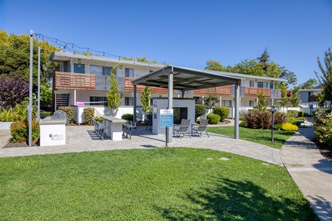 A building with a covered patio area in front.