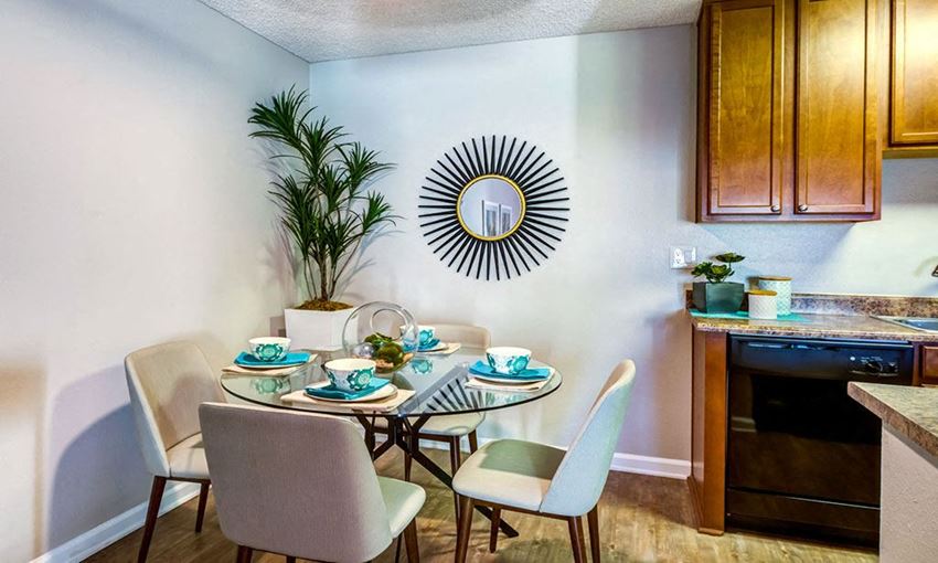 a dining room with a table and chairs