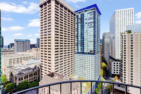 a view of the city skyline from a balcony