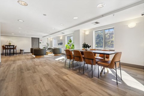 a dining room with a table and chairs