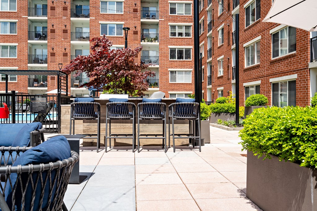 our apartments have a large patio with chairs and tables
