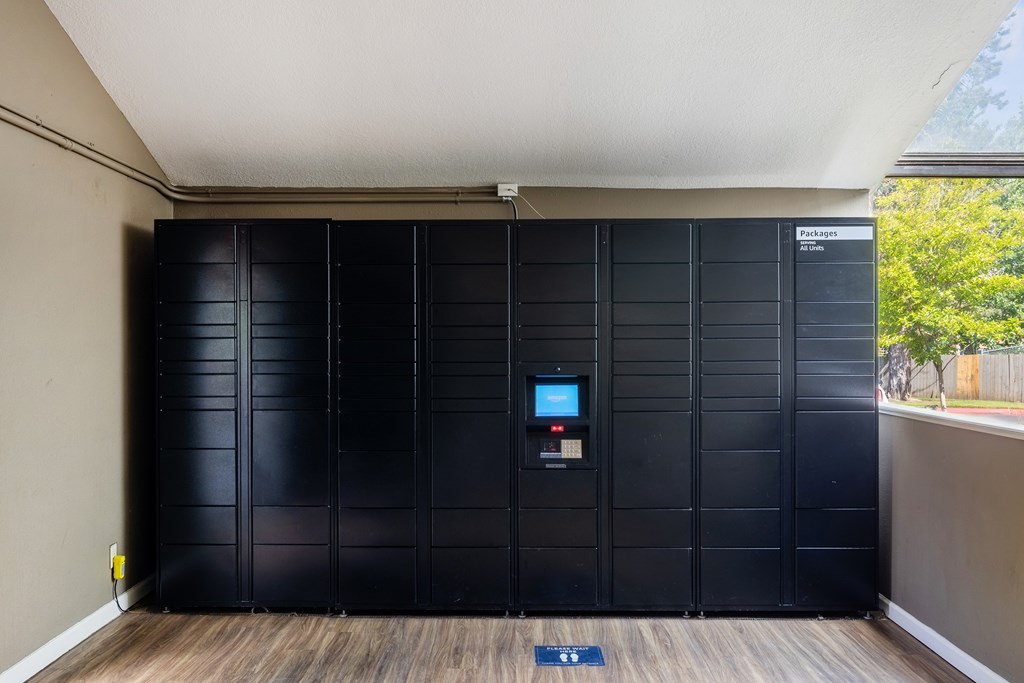 A black storage unit with a digital display in the middle.