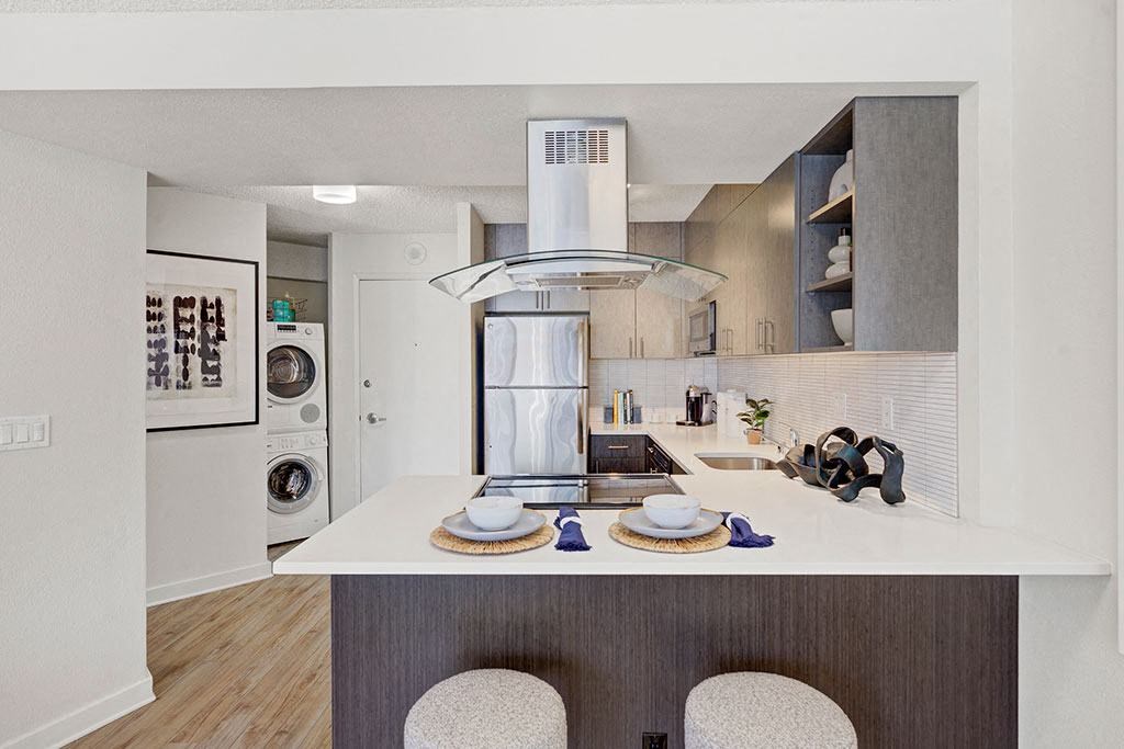 a kitchen with a white counter top