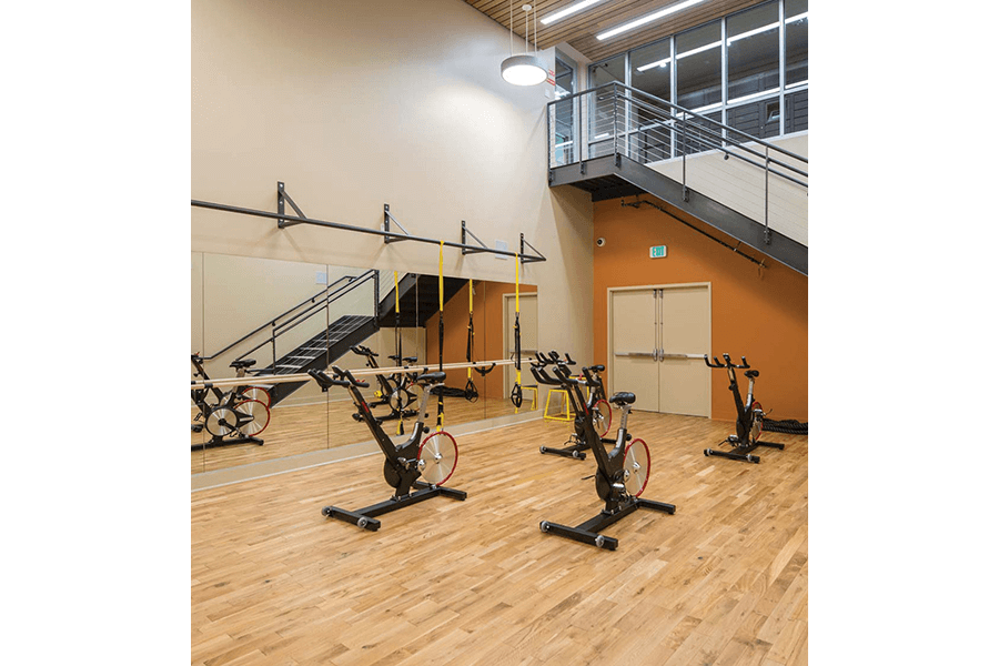 the gym has plenty of exercise bikes and a staircase