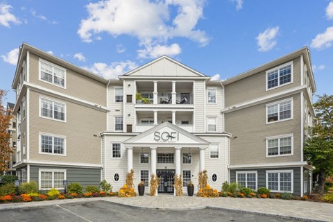 The image shows a large, modern building with the name "SOF" prominently displayed on the front.