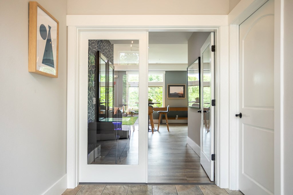 a view into the living room from the hallway of a house