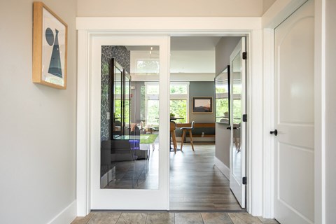 a view into the living room from the hallway of a house