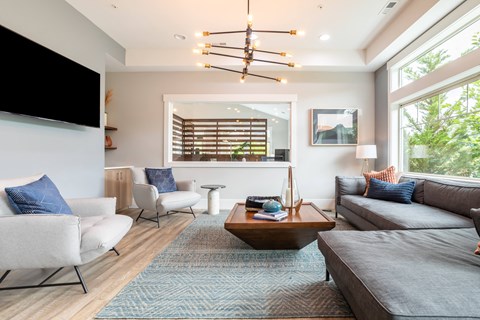 a living room with couches and chairs and a coffee table