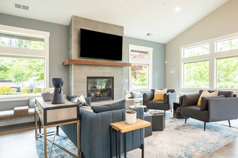 a living room with a fireplace and a tv above it