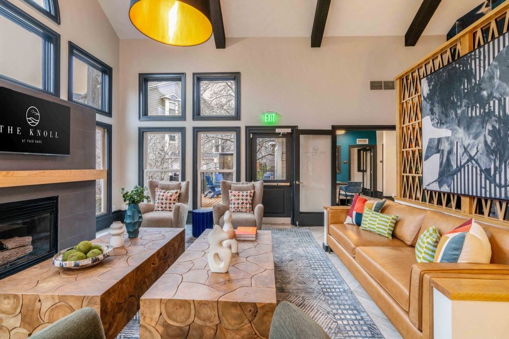 A living room with a fireplace and a couch.