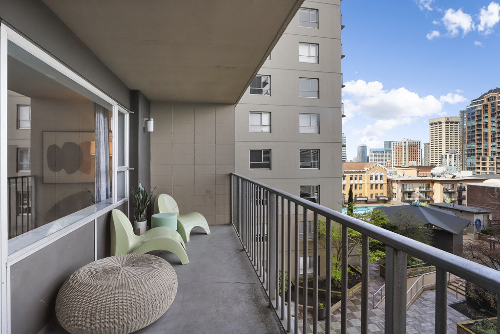 a balcony with a view of the city