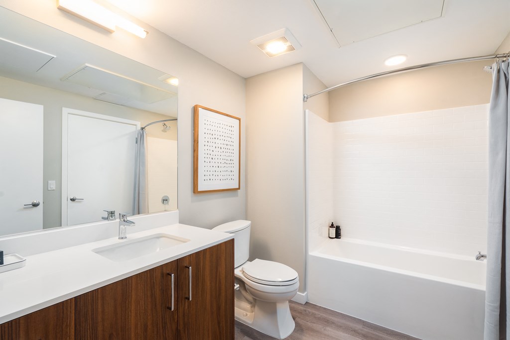 a bathroom with a sink toilet and a shower