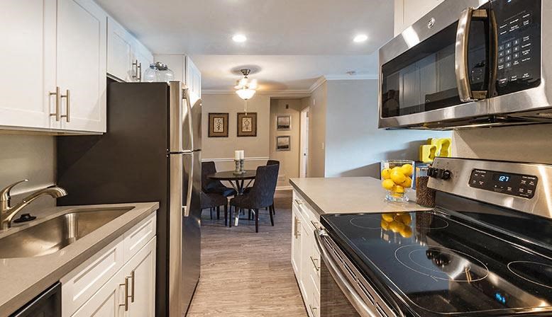 a kitchen with a stove and a microwave