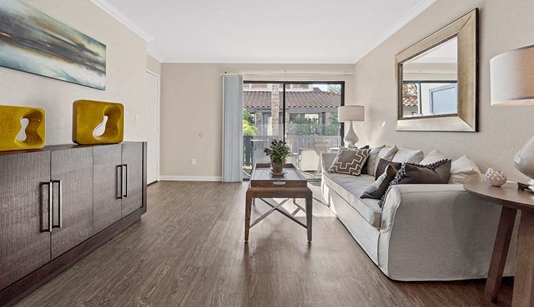 a living room with a couch and a table