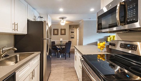 a kitchen with a stove and a microwave