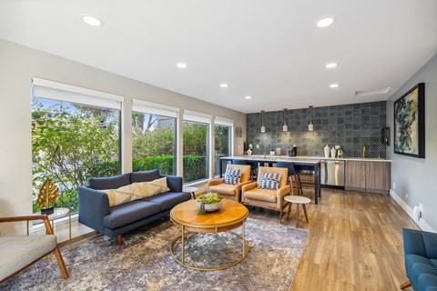 Clubhouse with a blue couch and a coffee table.
