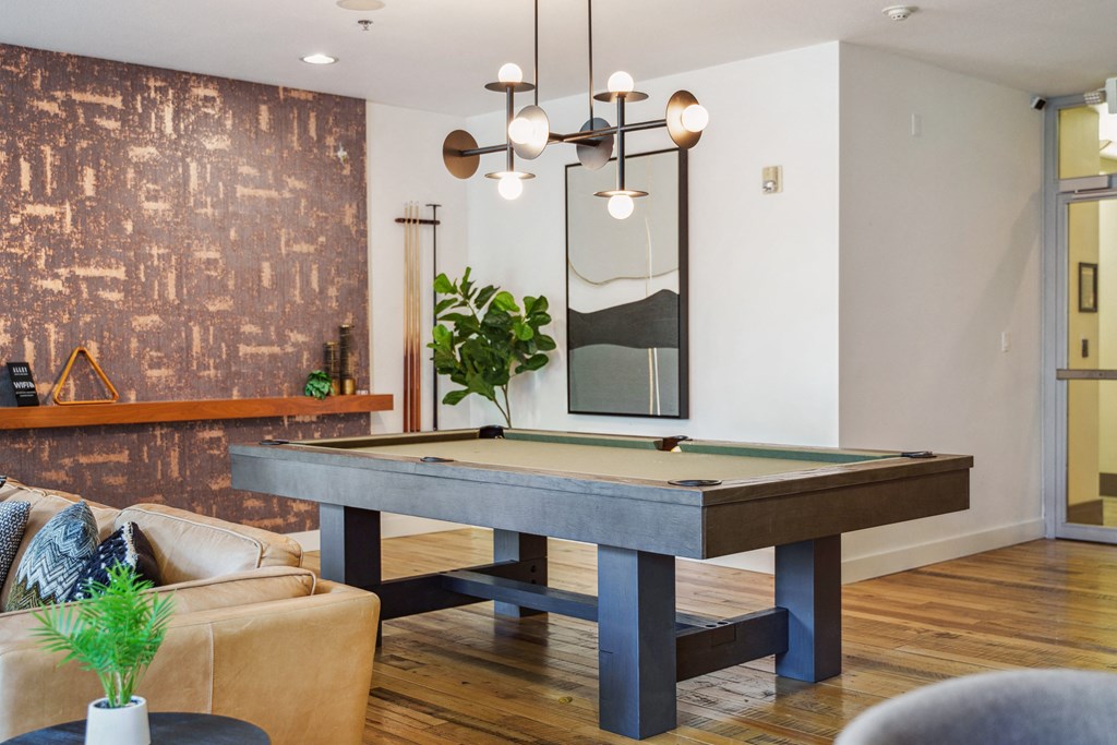 a pool table in the living room of a home