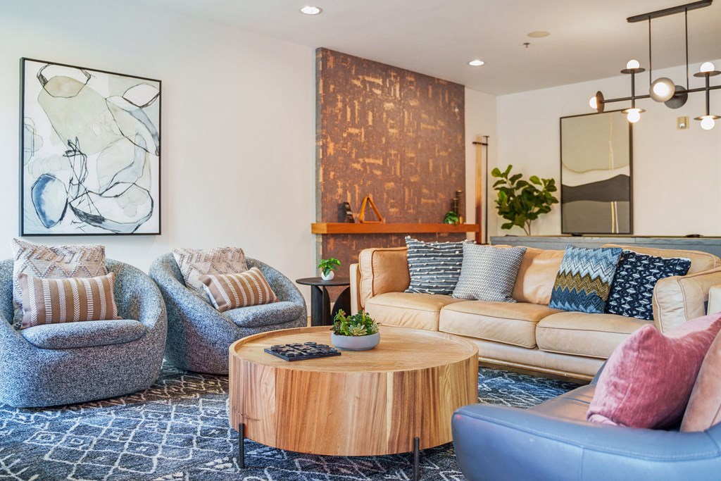 a living room with couches and chairs