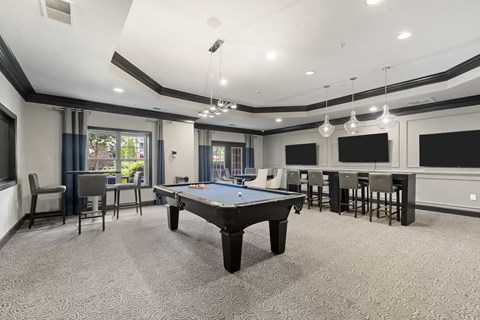 play a game of pool in our game room at our apartments