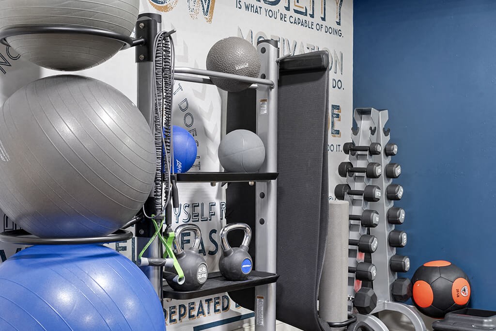 a variety of weights and other equipment in a gym
