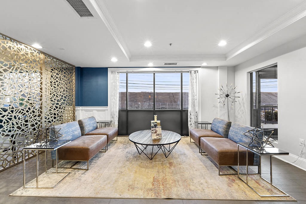 a living room with couches and a table