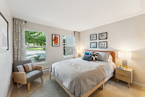 a bedroom with a large bed and a window