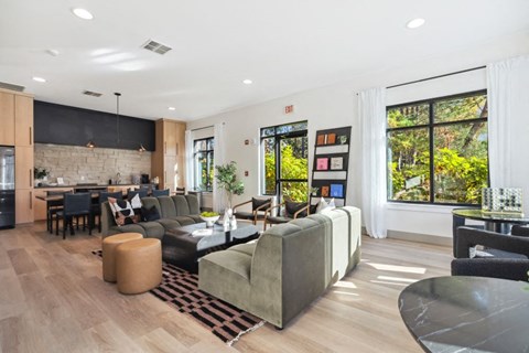 the living room is open to the dining room and kitchen