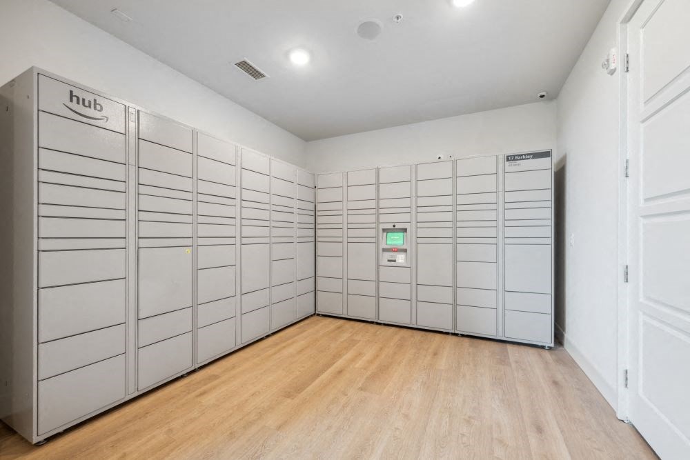 a large room filled with white lockers and a wooden floor