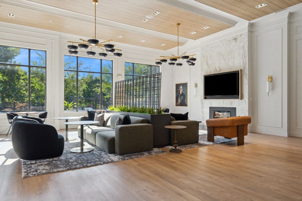 a living room with couches and chairs and a fireplace