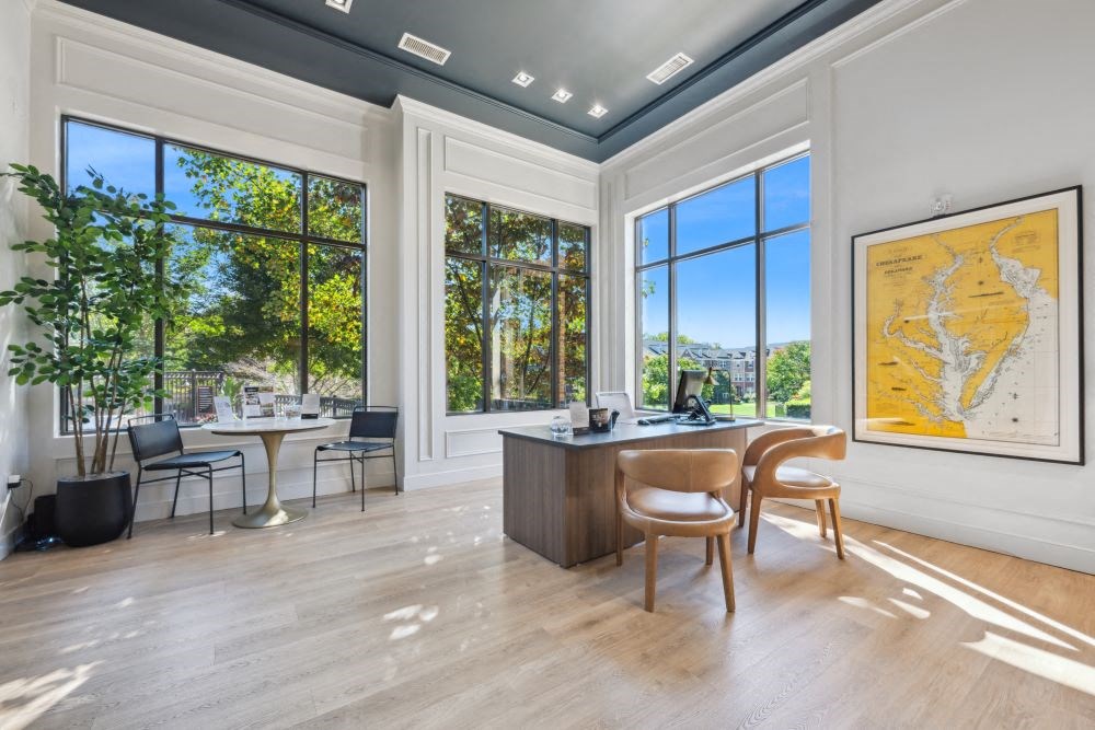 the home has an office with a desk and a view of the city