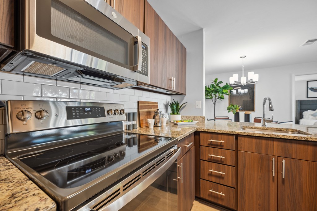 a kitchen with stainless steel appliances and granite counter tops