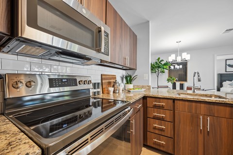 a kitchen with stainless steel appliances and granite counter tops