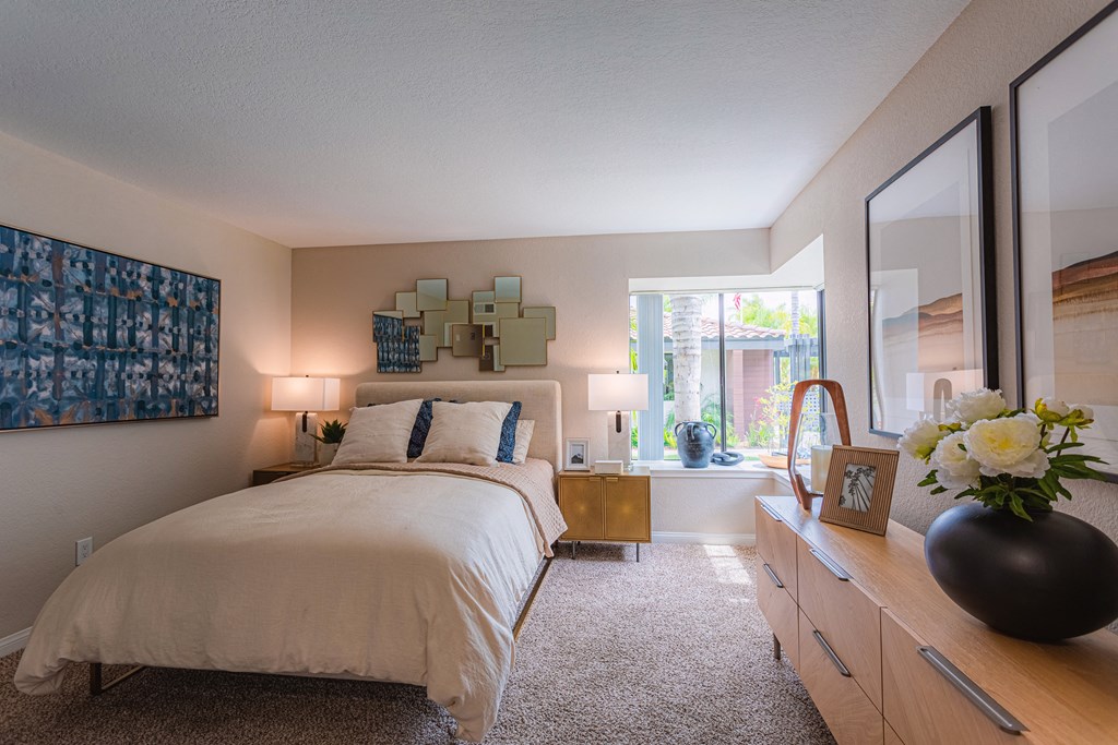 Sofi at Wood Ranch Apartments Bedroom with large bed and dresser