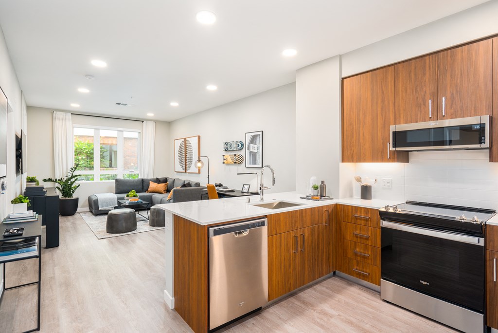 a living room with a kitchen and a couch