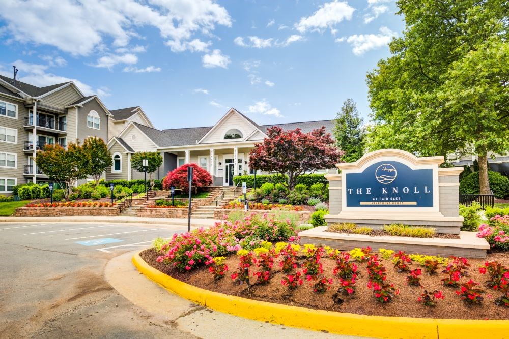 The Knoll is a residential complex with a well-maintained entrance.