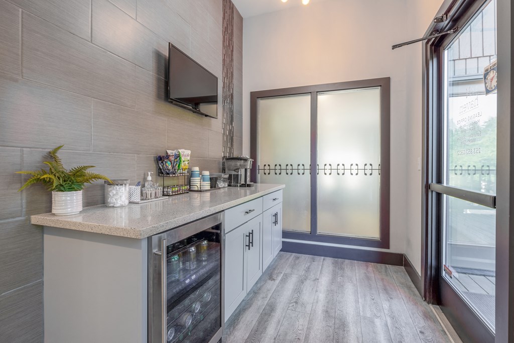 a kitchen with a counter top and a door to a hallway