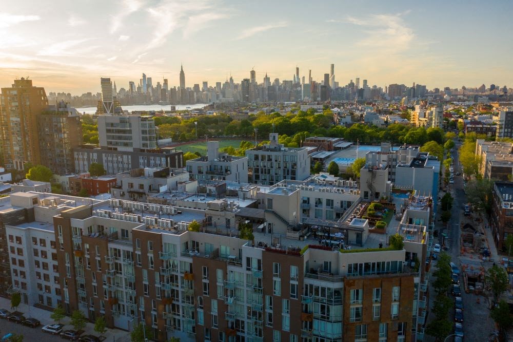 A cityscape with a mix of residential and commercial buildings.