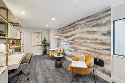 an office with chairs and a desk and a toilet