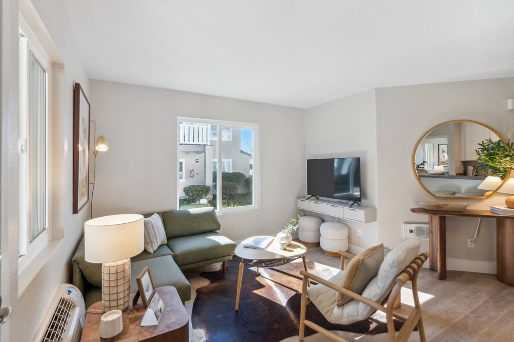 a living room with a couch and a table and a television